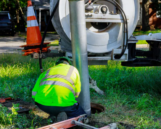worker cleans blockage in a sewer line newport wa
