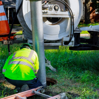 worker-cleans-blockage-in-a-sewer-line-with-a-tank-truck-newport-wa